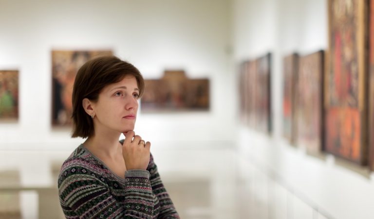 woman looking at an art gallery