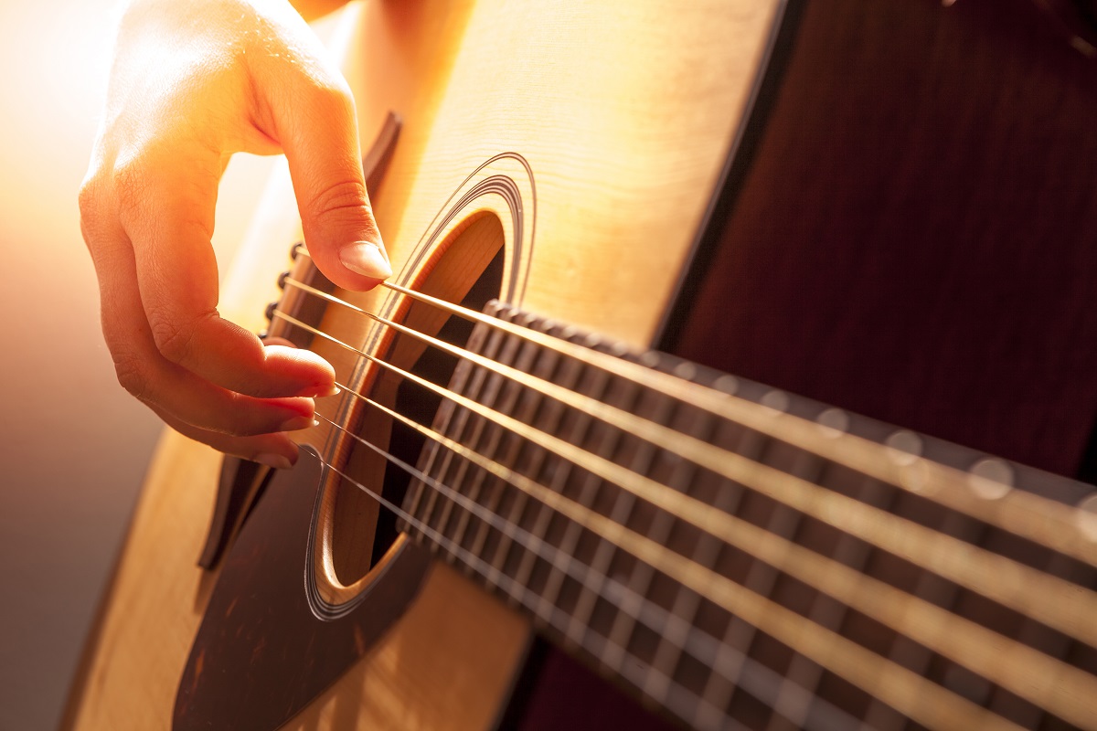 Person playing the guitar